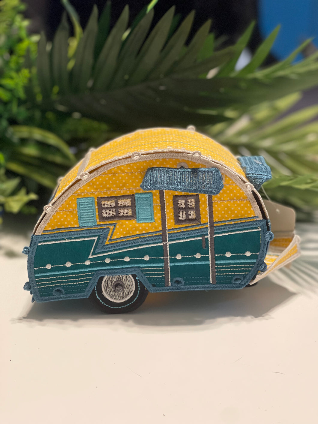 Yellow and teal camper